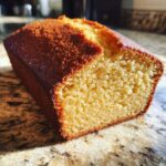 Close-up of a freshly baked Honey Cake, showing its golden-brown crust and tender crumb.