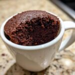 Close-up of a rich, dark chocolate mug cake, a perfect example of Birthday Cake Alternatives.