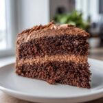 A close-up of a moist, layered chocolate slice from one of the amazing Keto Cakes.