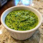 Close-up of vibrant green Witch Brew Salsa Verde Cream Dip texture in a small white bowl.