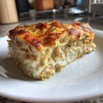 A generous slice of creamy, layered Ghostly Lasagna with a perfectly browned, cheesy top.